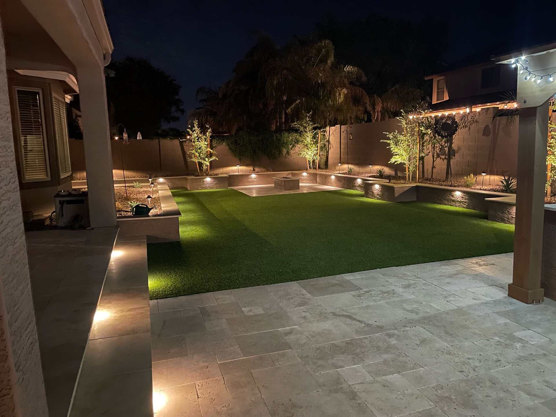 Ambient, outdoor lighting in Arizona home, project done by Diamond Stone & Synthetic Grass in Arizona.